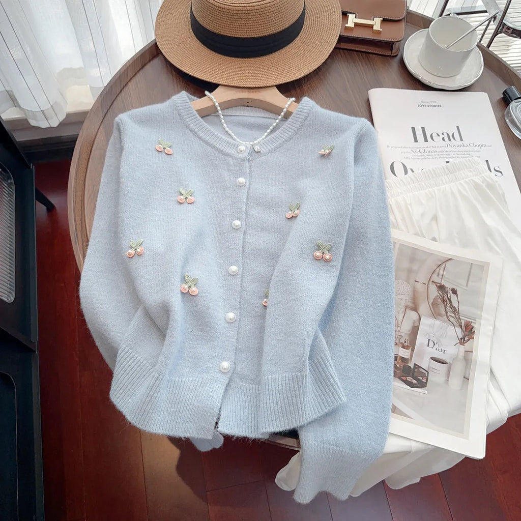 Cashmere blend slim fit cardigan sweater coat with beaded decoration on a hanger.
