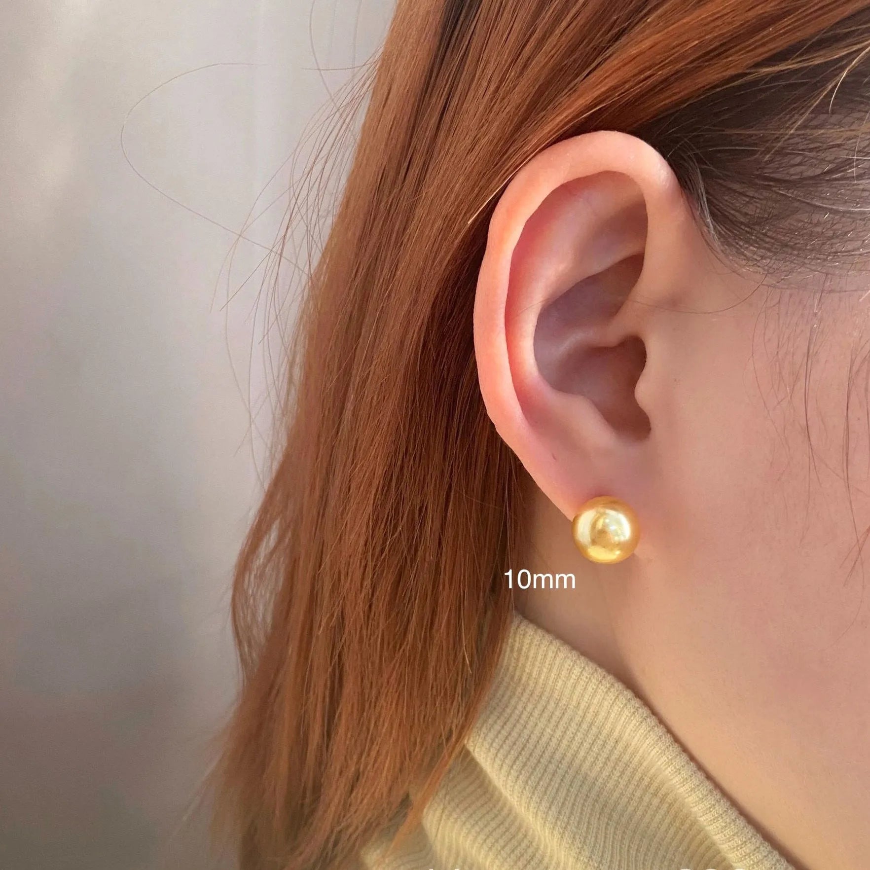 Geometric large pearl stud earrings with eight-point star design in silver setting.