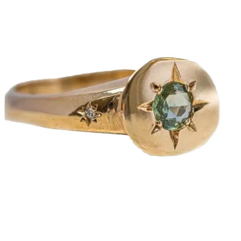 Gold coloured adjustable ring with star-shaped asterism zircon detail and micro inlay treatment