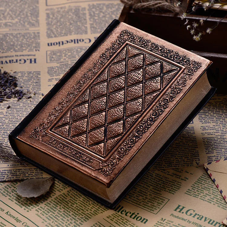 Embossed faux leather notepad showing three-dimensional geometric pattern in bronze colour with thick paper pages