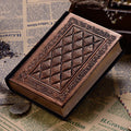 Embossed faux leather notepad showing three-dimensional geometric pattern in bronze colour with thick paper pages