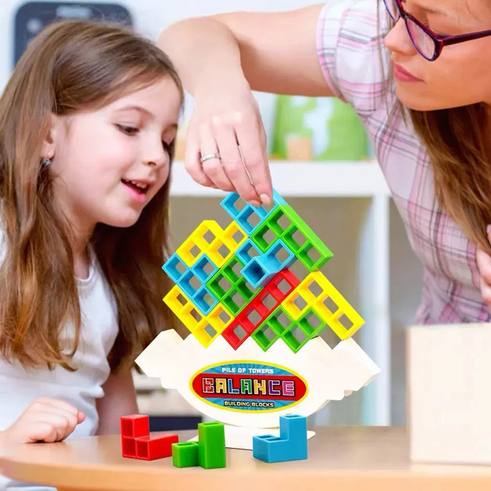 Plastic balance stacking game with 16 coloured blocks, chassis and base for family travel parties