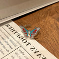 Creative Chinese butterfly women's copper ring with oil-dripping surface treatment in split ring design.