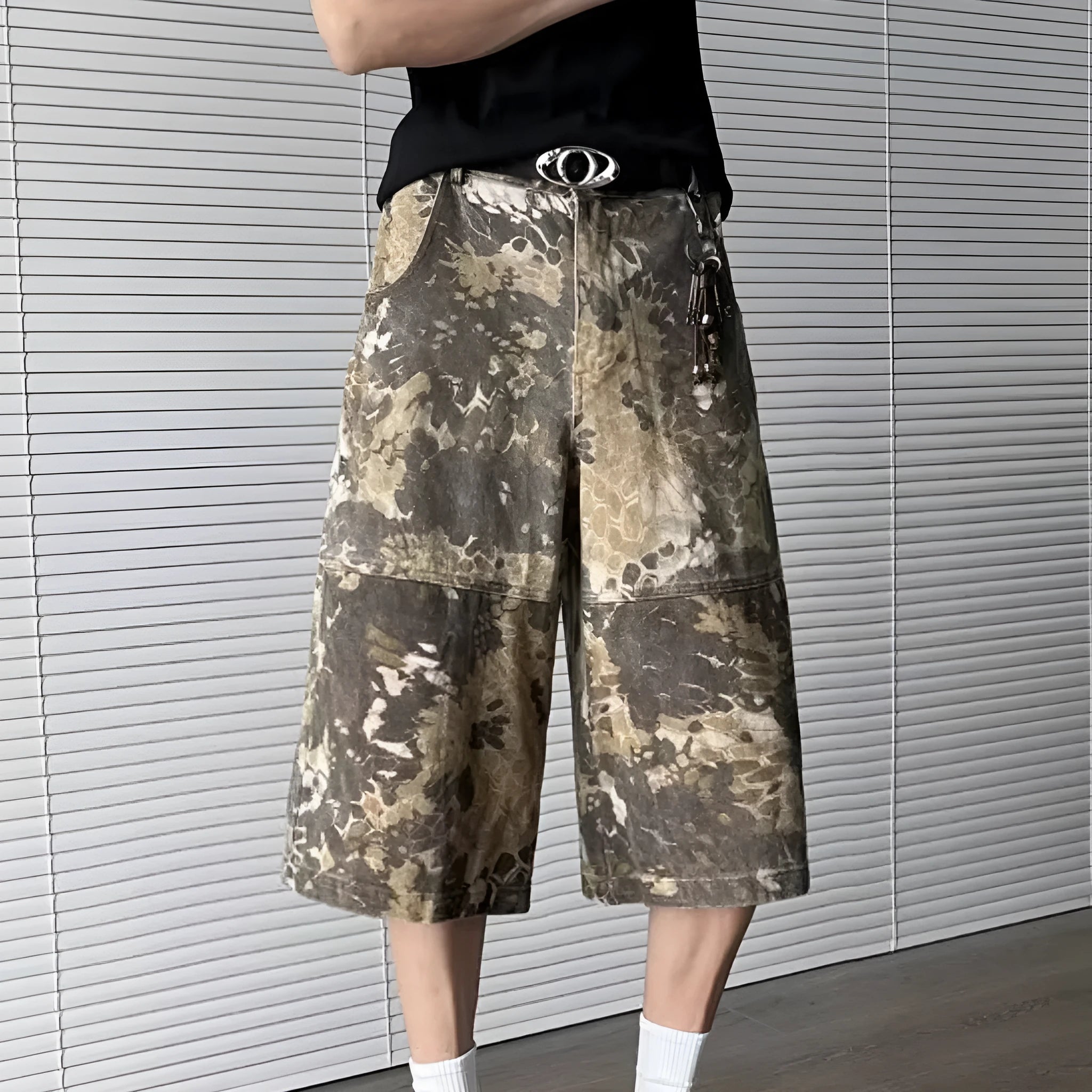 Yellow jeans with snake pattern camouflage design in cropped length