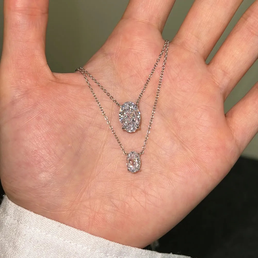 Sterling silver necklace with geometric oval ice flower pendant in electroplated platinum or gold finish