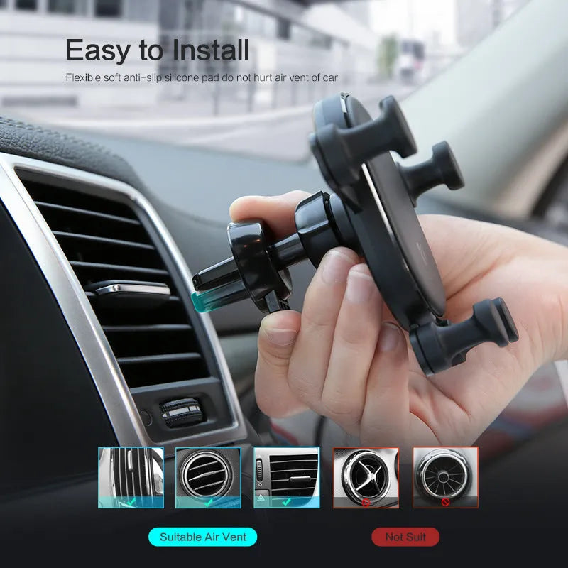 Black gravity car phone holder with 360 rotation mounted on air vent, holding a smartphone