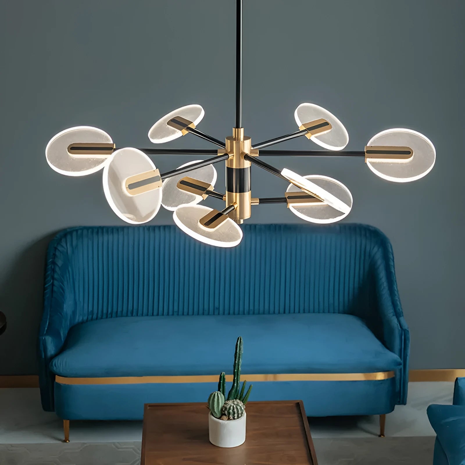 Modern iron and acrylic LED chandelier pendant light with multiple heads for ceiling installation.