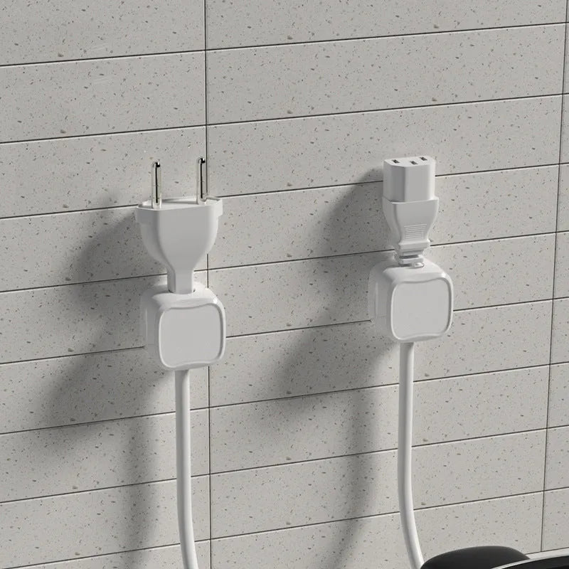 White and black cable clips holding under desk wires including USB and HDMI cables