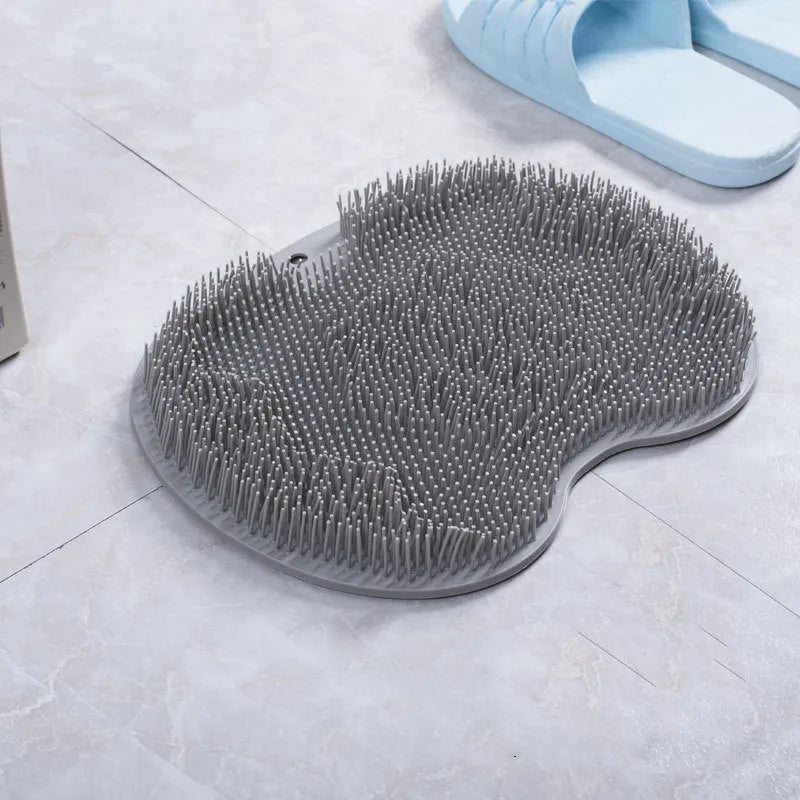 Non-slip bath mat with silicone bristles and suction cup base in a shower