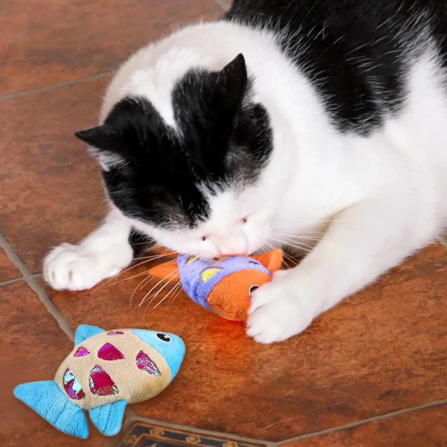 Two soft plush goldfish-shaped catnip cat toys with crinkle paper on a light background