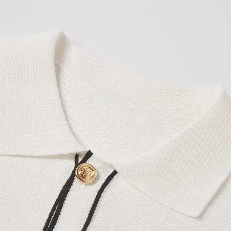 White women's short sleeve cardigan with contrast colour lapels on a hanger