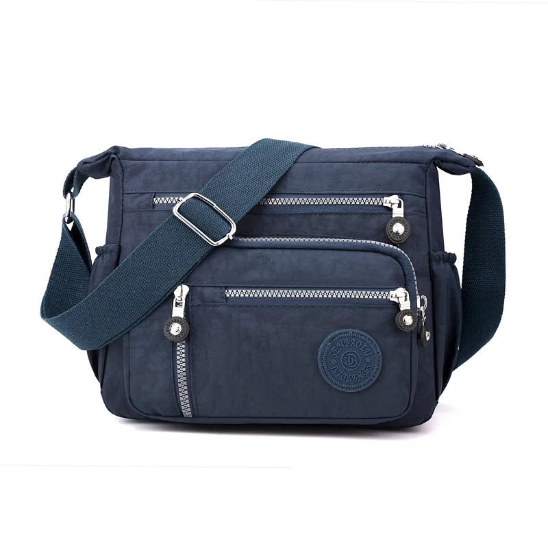 Nylon messenger bag with square vertical shape in one of five colour options