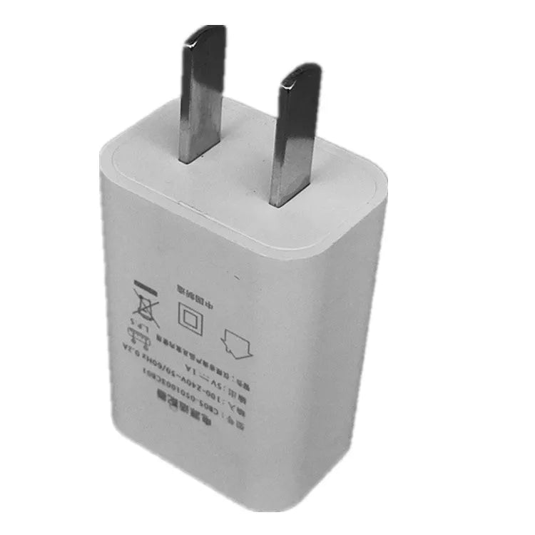 White 5V 1A USB wall charger with UK plug and CE FCC marks.