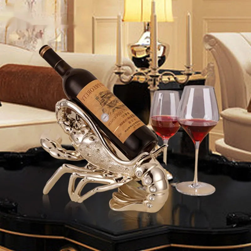 Lobster-shaped wine rack ornament in rose gold metallic finish displaying wine bottle