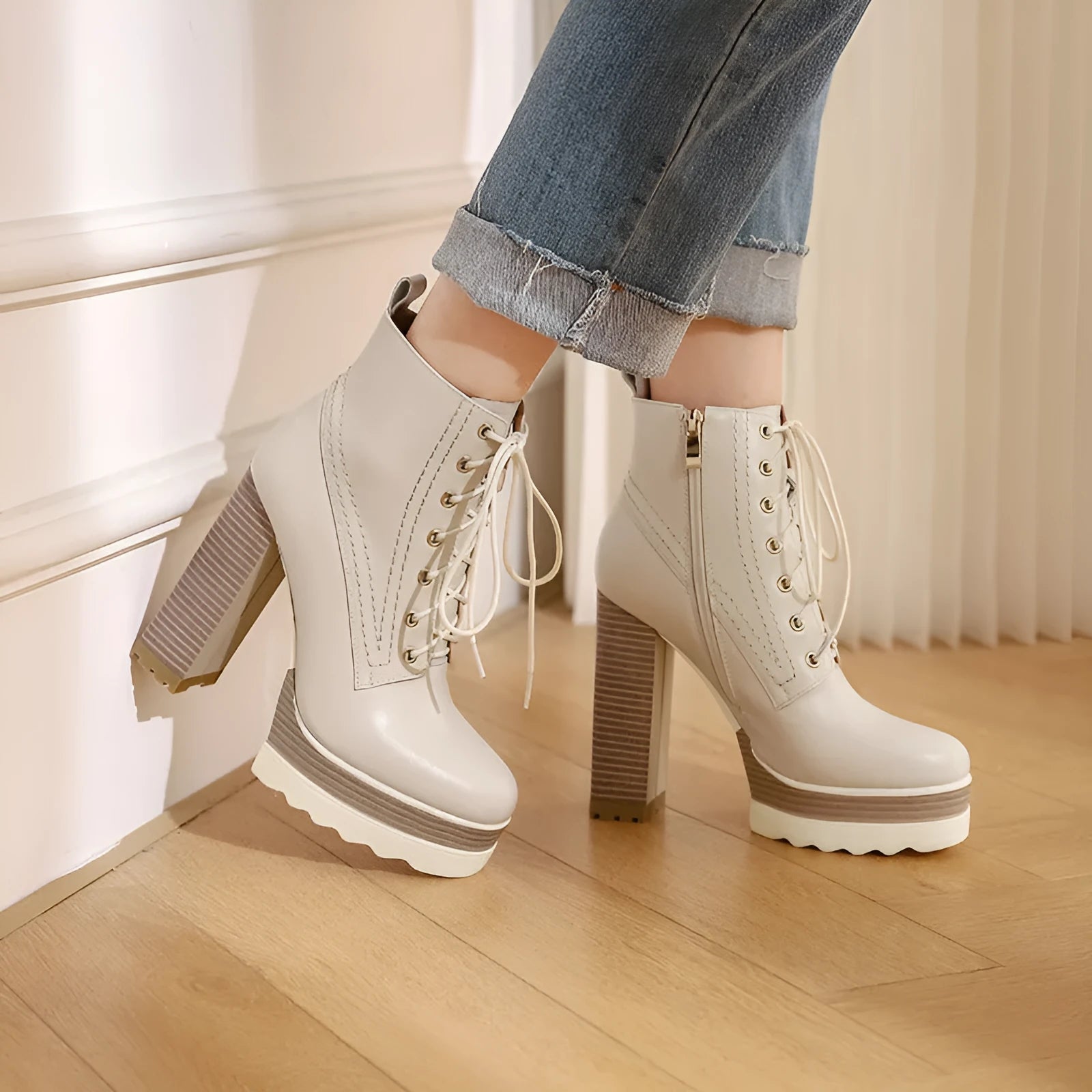 Women's chunky heel waterproof platform high heel boots in black cowhide leather with side zipper and round toe.