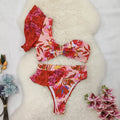 Women's pink floral print bikini with one-shoulder ruffled design and high-waisted briefs