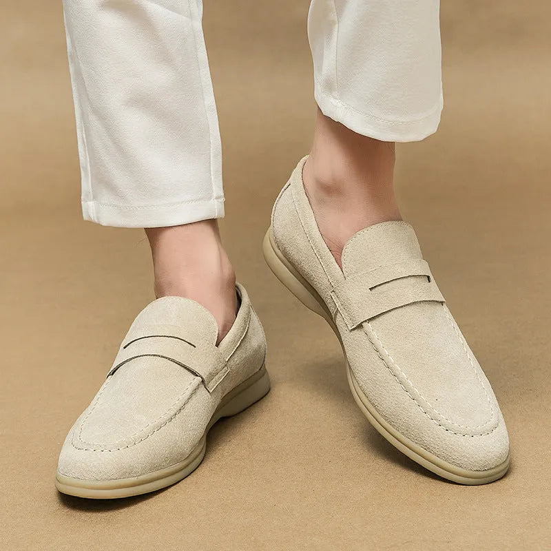 Men's black leather slip-on casual shoes with a round toe and rubber sole.