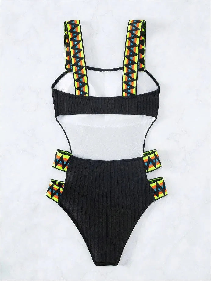 Women's solid black or orange one-piece polyester swimsuit with size guidance
