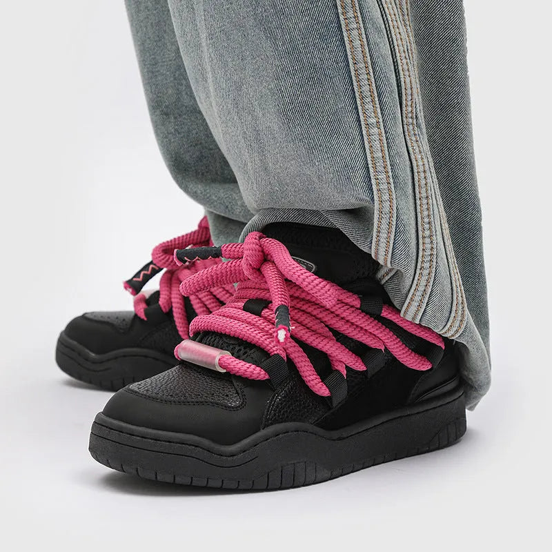 A pair of solid-colour casual lace-up shoes with a thick rubber sole and round toe