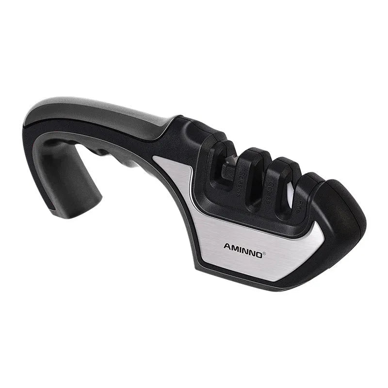4-in-1 kitchen knife sharpener with multiple slots, black and cyan plastic and stainless steel body on a countertop
