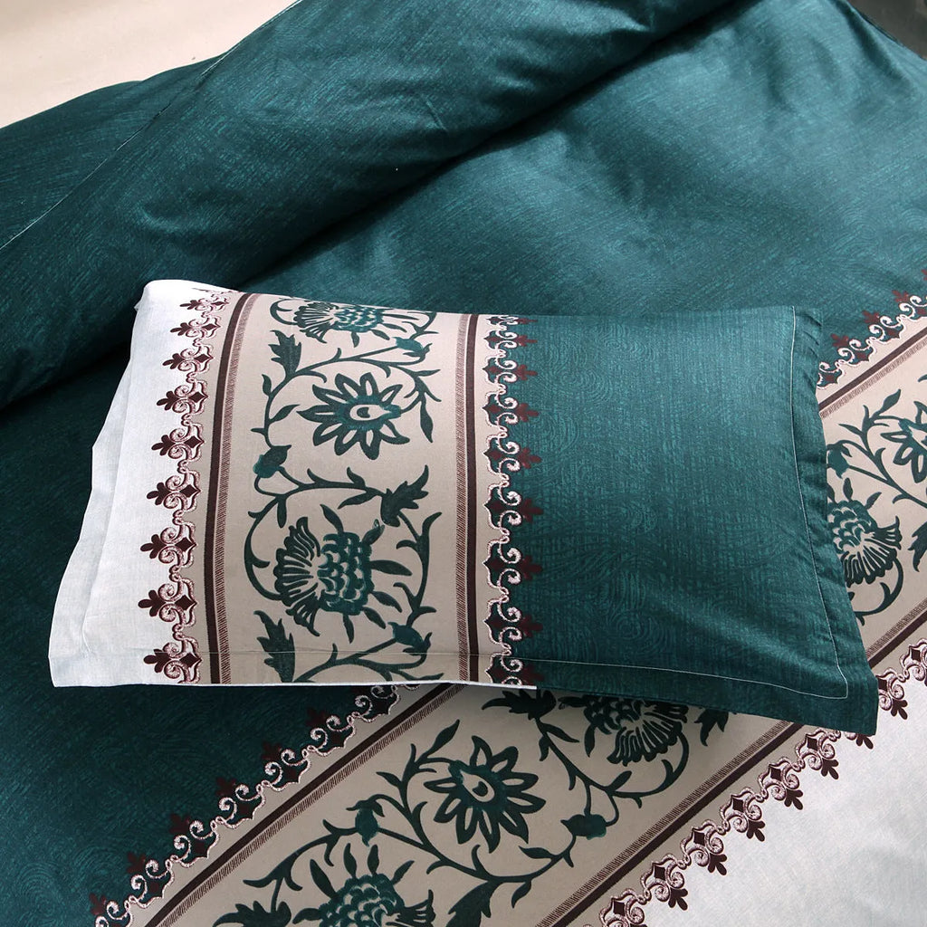 Polyester duvet cover set with plain weave reactive printing in peacock blue colour on a bed