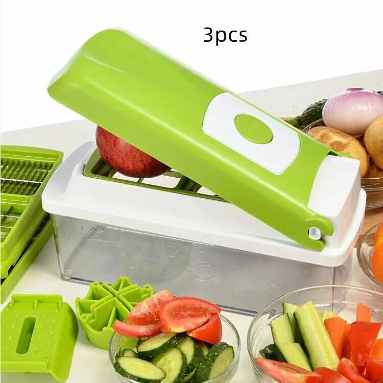 Green multifunctional vegetable chopper with handle, grater, and stainless steel blades on a chopping board