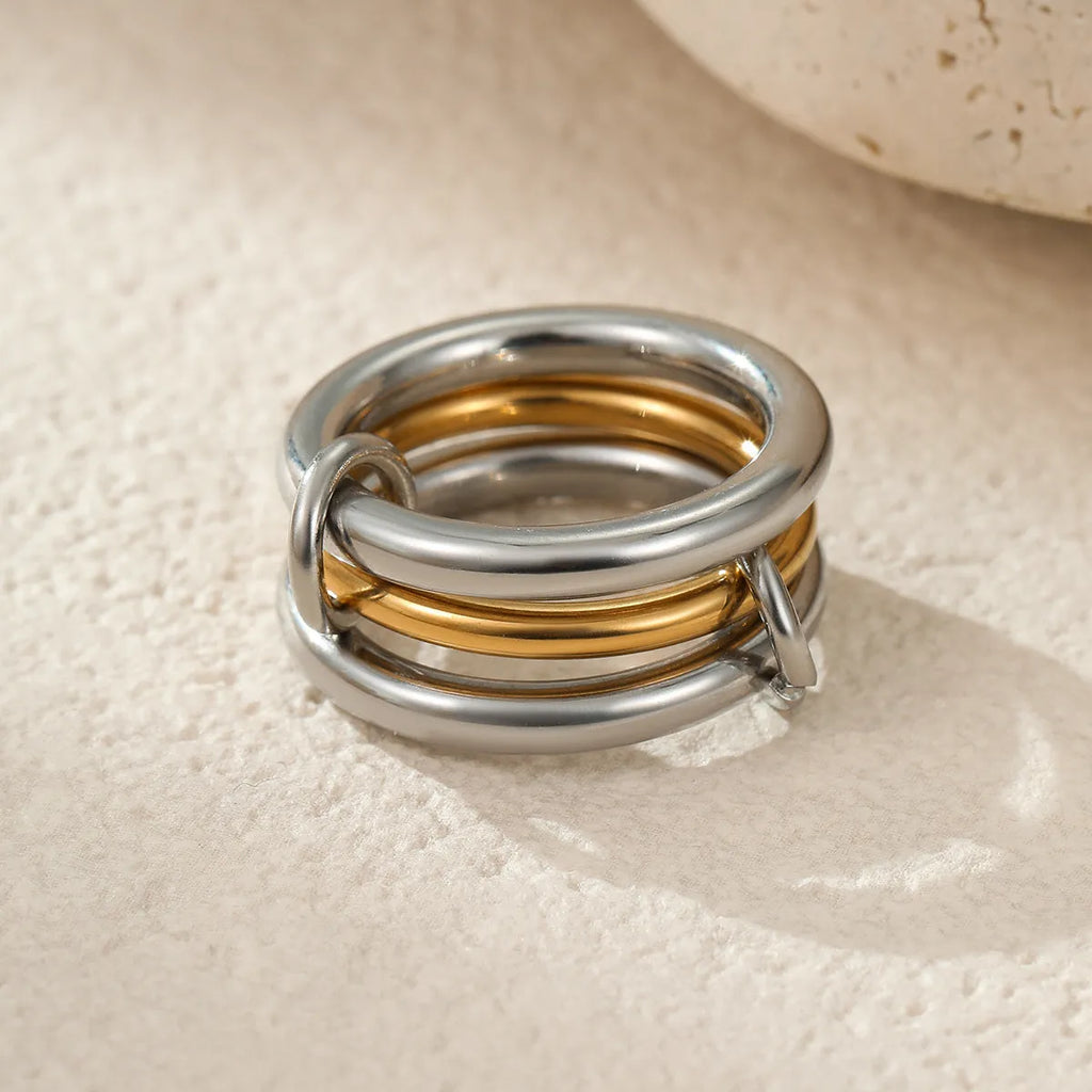 Gold plated stainless steel stacked ring set for women in an exaggerated free-size design.