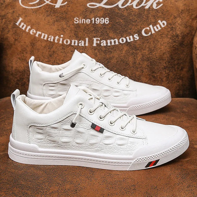White men's casual sneakers with lace-up closure, rubber sole, and round toe cap on a plain background