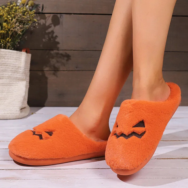Orange plush-lined indoor slippers with non-slip PVC soles and coral velvet upper