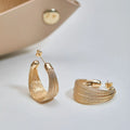 Copper geometric bracelet earrings set showing silver and gold electroplated stud and clip earring pairs