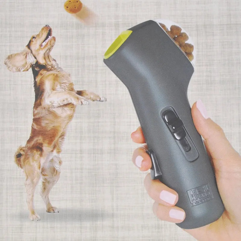 Grey pet snack catapult launcher showing spring trigger mechanism and compact 18cm design