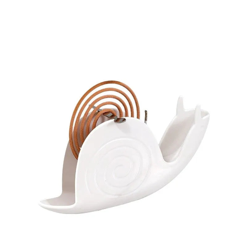 Plastic mosquito incense holder in black creative animal style on a table