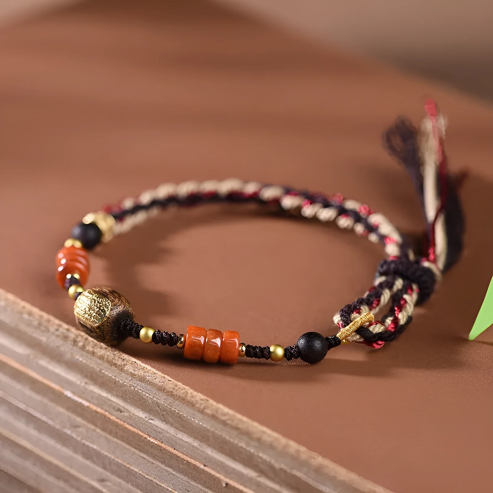 Hand-woven lapis lazuli flexible wire bracelet with simple ethnic design on white background