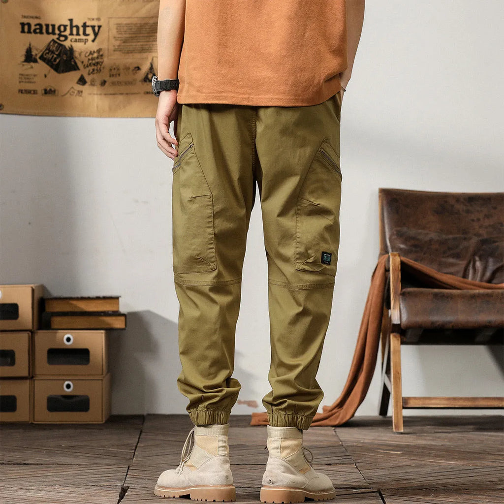 Men's tapered harem trousers in cotton fabric with elastic waist and ankle banding detail