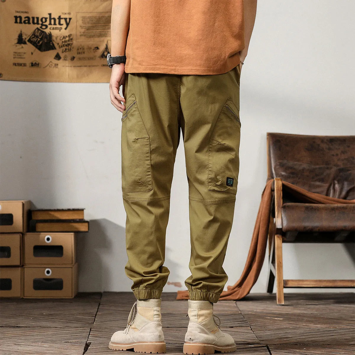 Men's tapered harem trousers in cotton fabric with elastic waist and ankle banding detail