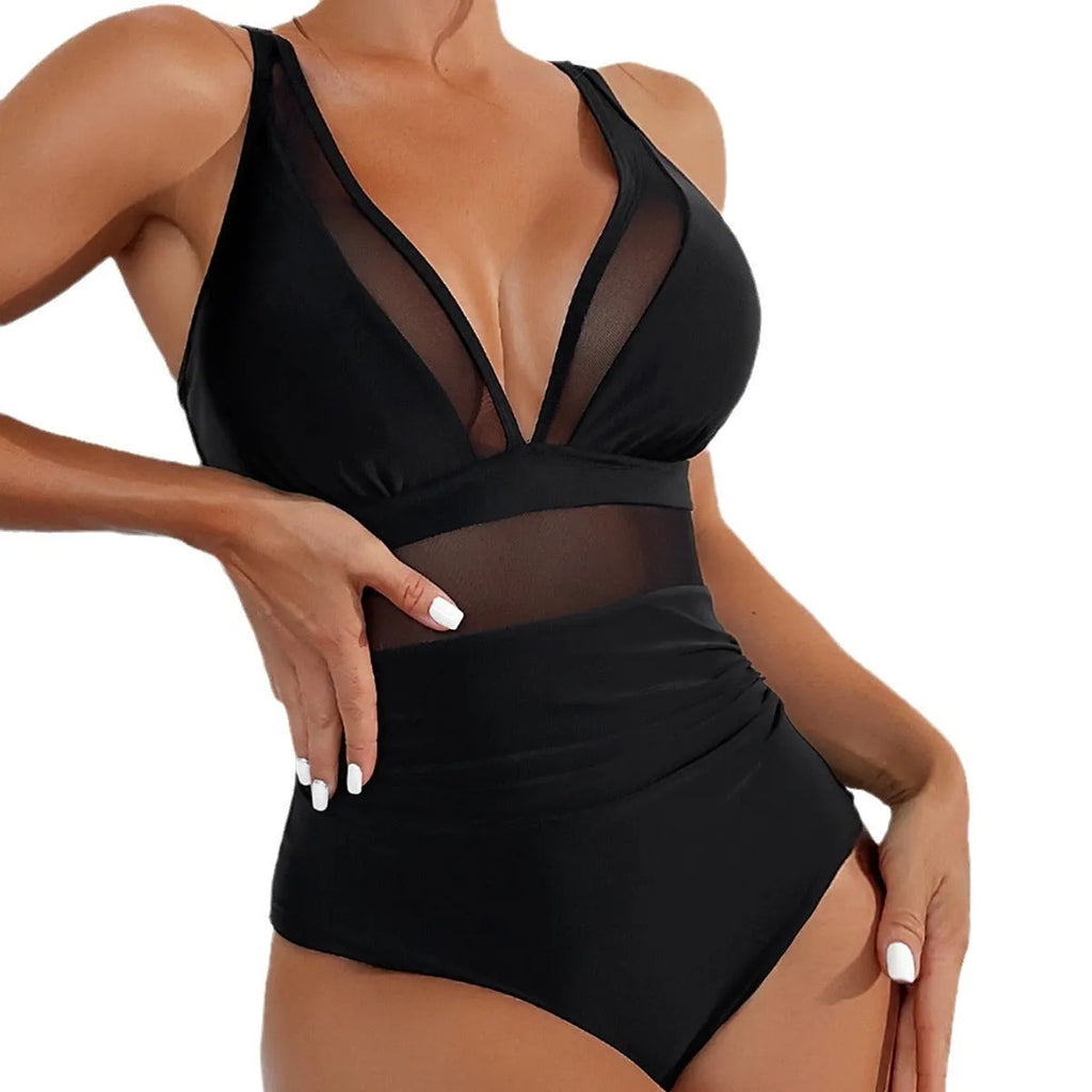Black halter neck one-piece swimsuit for women on a mannequin, showing sleeveless design and briefs style.