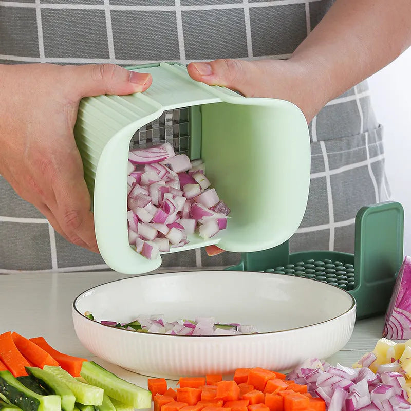 Green multifunctional vegetable chopper with hand pressure mechanism for cutting onions, potatoes, and cucumbers