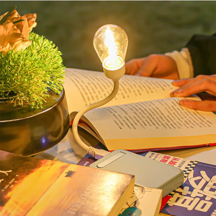Folding USB rechargeable night light with tungsten filament bulb in warm white illumination