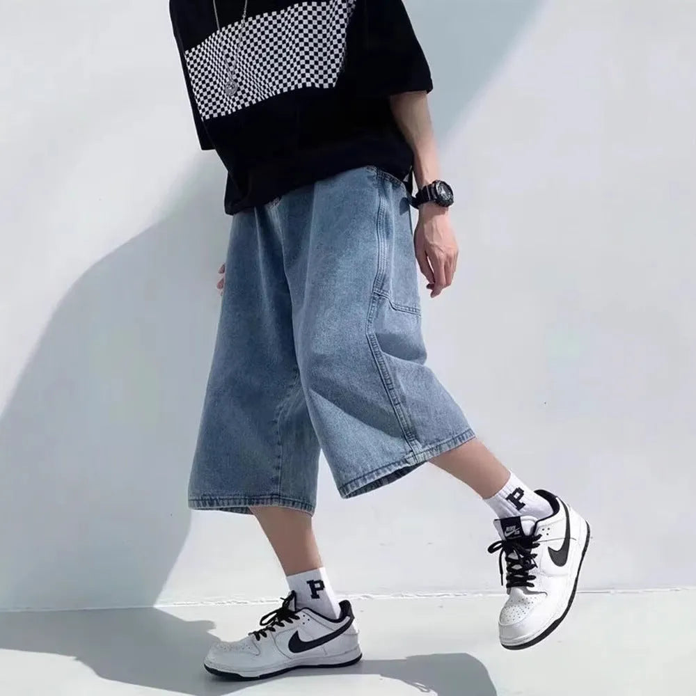 Men's high-waisted, cropped blue denim-style pirate shorts with a straight leg and zipper fly.