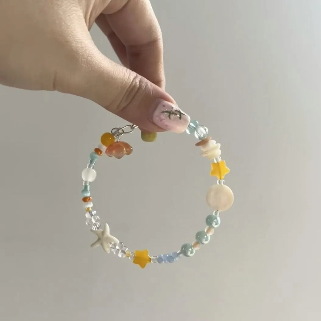 Orange alloy bracelet with diamond shape and round decorative elements for women's summer fashion