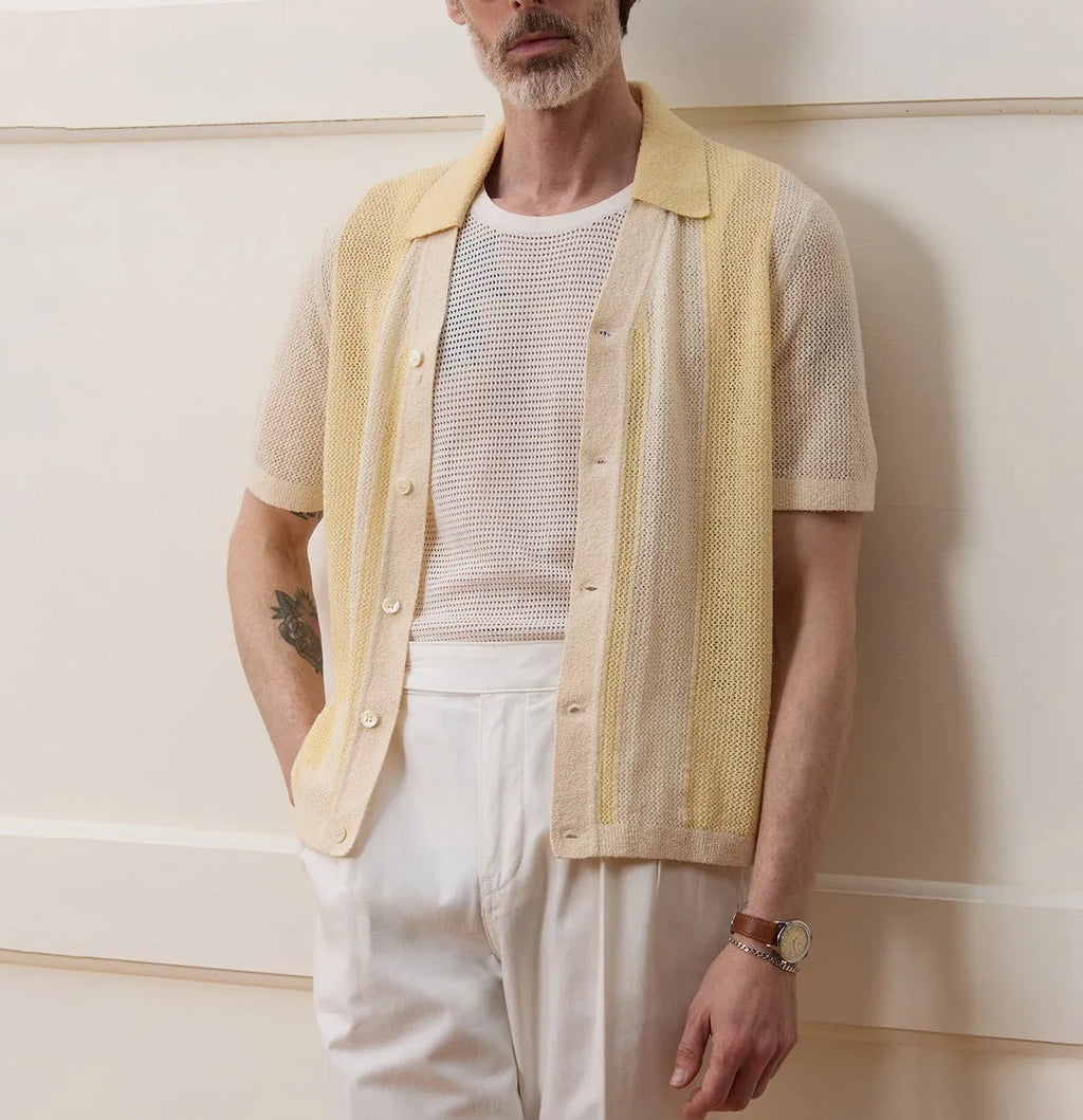 Yellow men's short-sleeve polo shirt with hollow-out design and asymmetric cut.