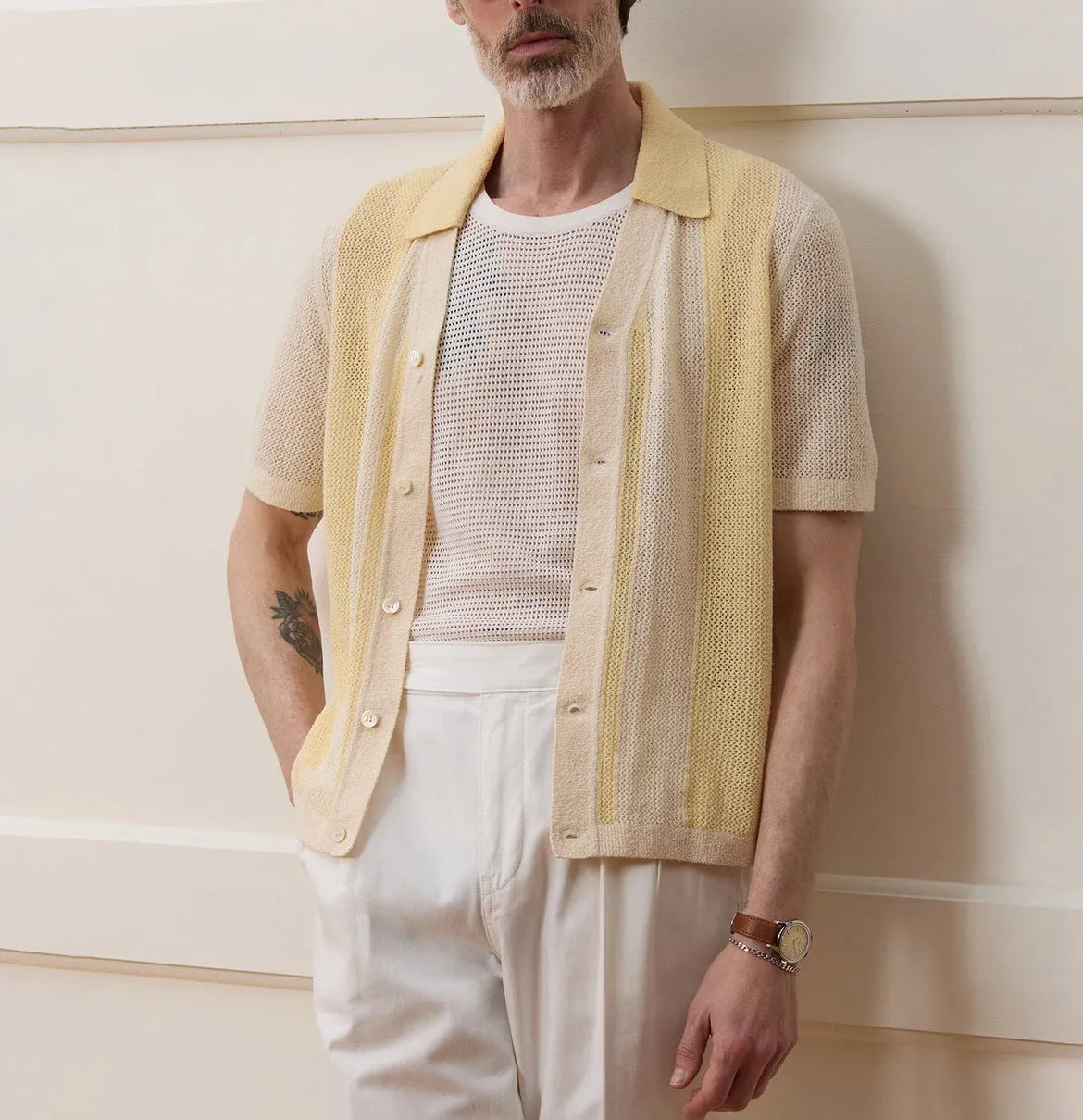 Yellow men's short-sleeve polo shirt with hollow-out design and asymmetric cut.