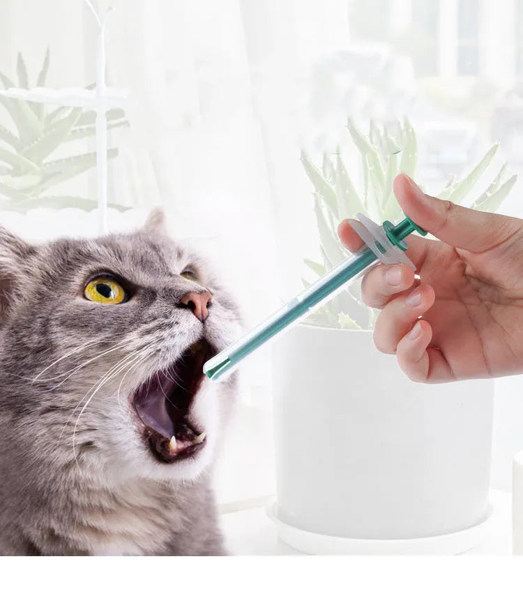 Two silicone-tipped pet pill shooters in different sizes on a white background.