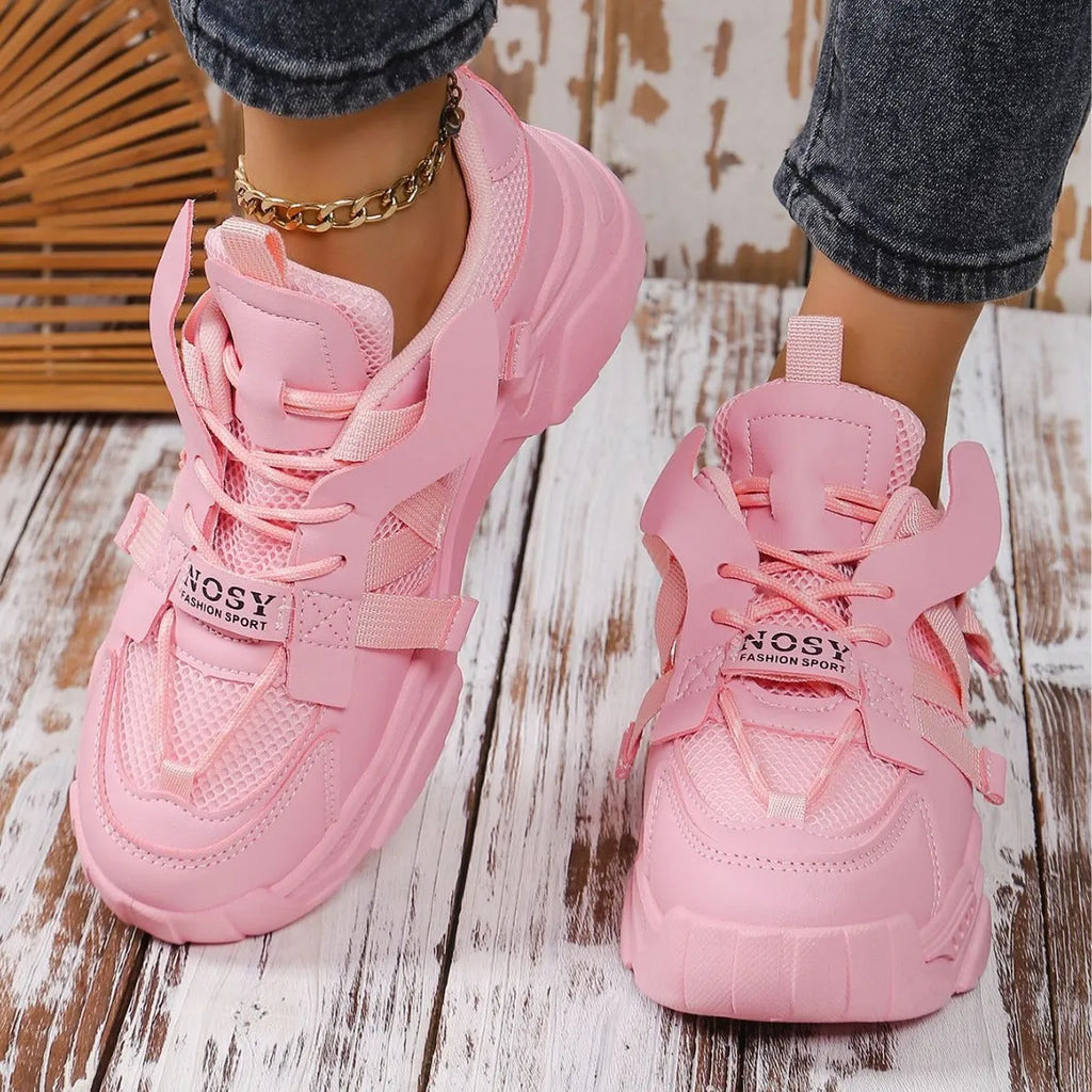 Women's purple platform mesh dad shoes with lace-up front, shown on a fitness floor.