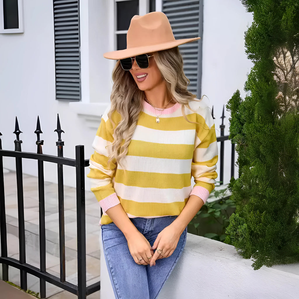 Women's loose fit long sleeve acrylic sweater in a striped pattern, shown in a blue colour.