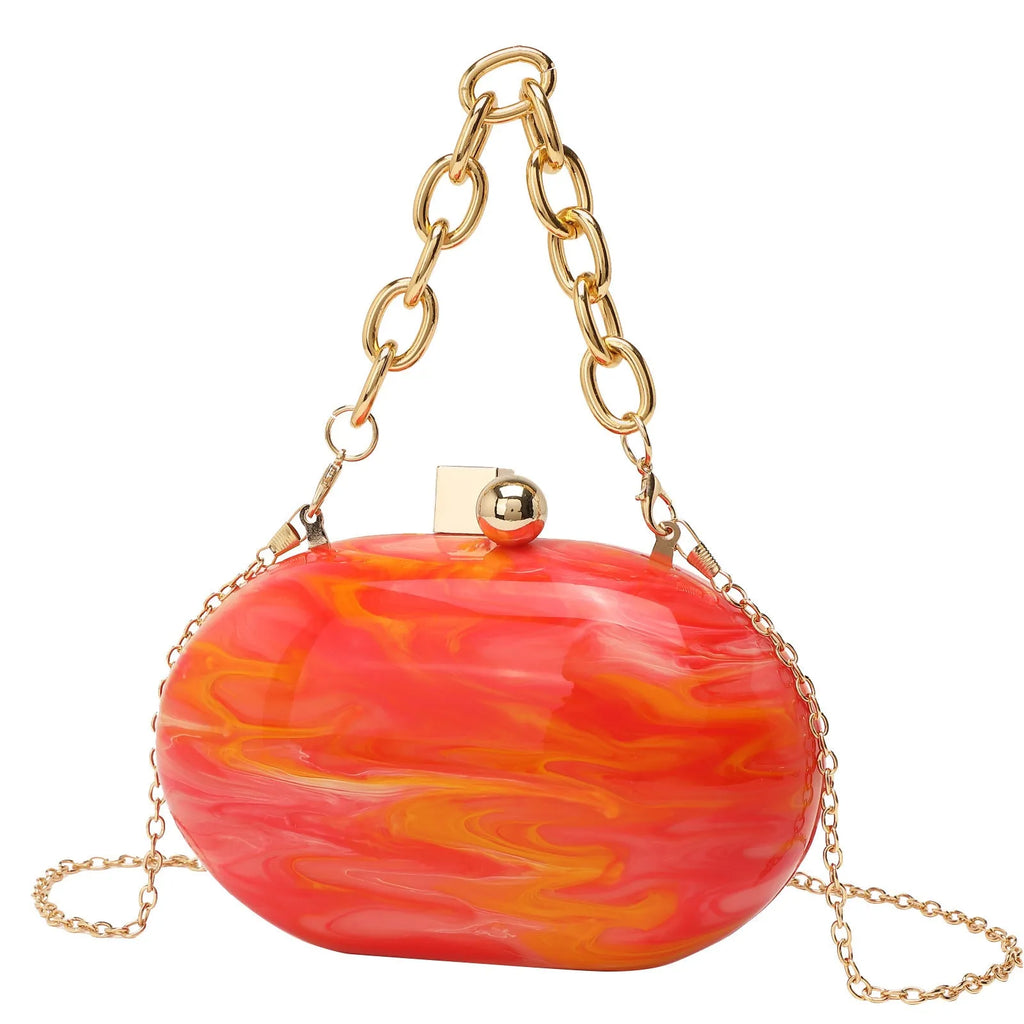 Oval acrylic chain crossbody handbag in pearlescent white with chain strap and hard shell structure