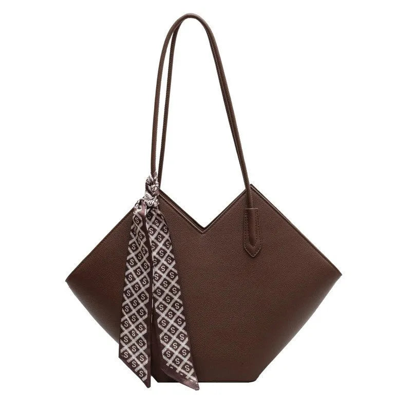 Women's large black PU leather shoulder bag with a sandwich pocket, shown next to a brown version.