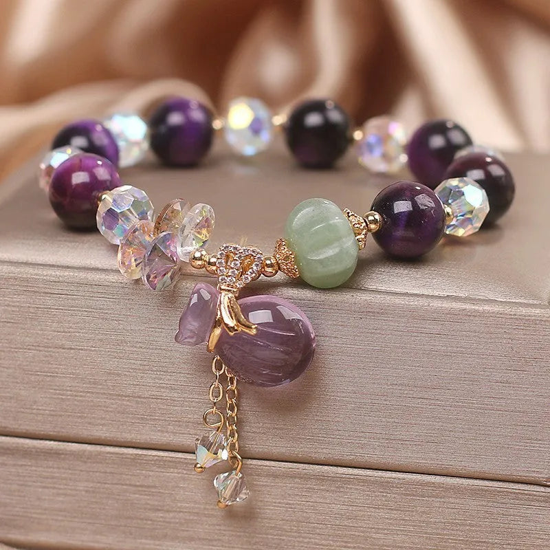 Women's retro transport bracelet with purple tigereye pendant, crystal and rhinestone accents