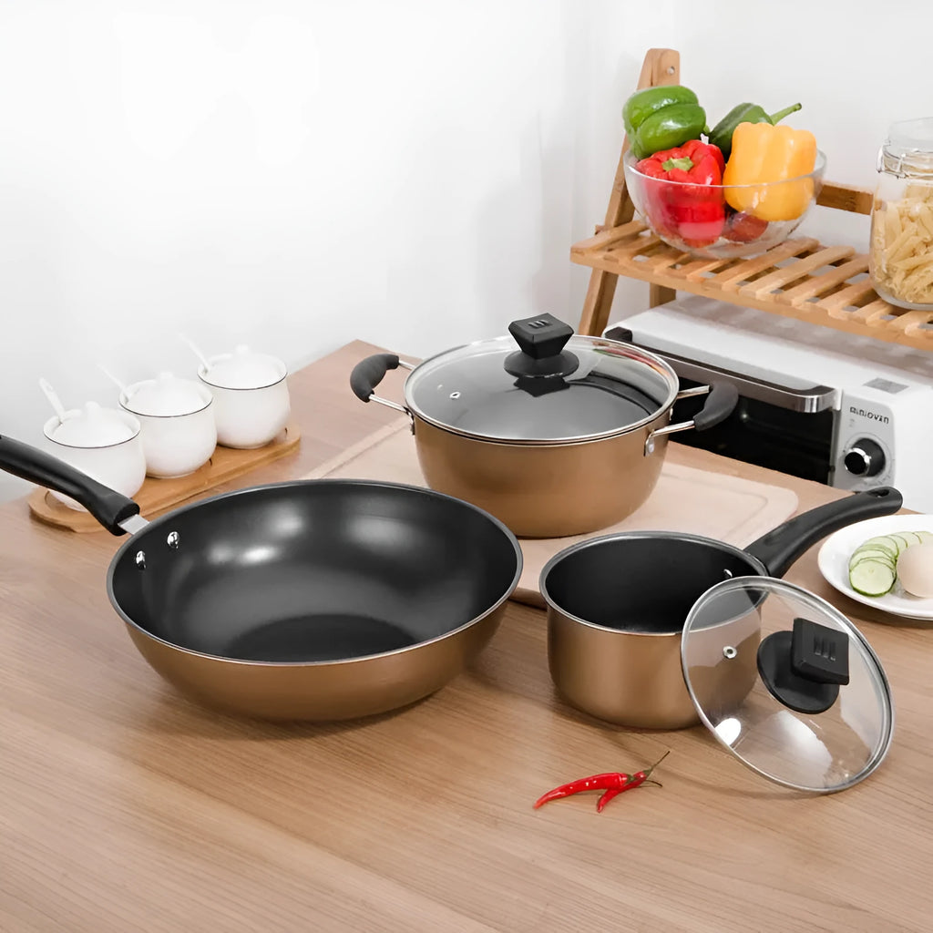 Three-piece cast iron non-stick cookware set with soup pot, milk pot, and wok in light luxury style