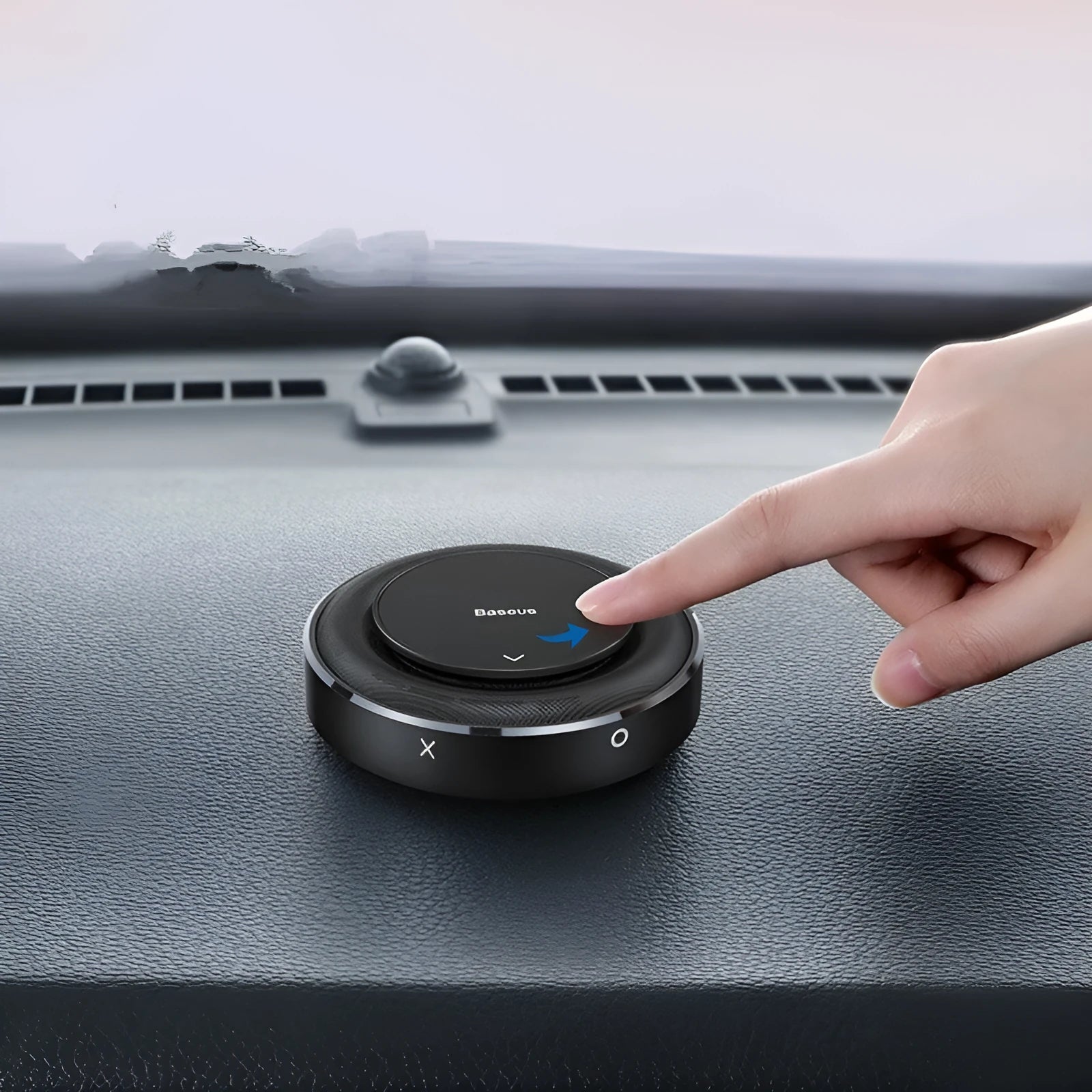 Black aluminium alloy round car fragrance seat with aromatherapy tablets on a car dashboard.